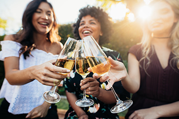 friends toast glasses and wine at a party